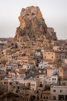 Explore the historic rock formations and traditional architecture of Ortahisar, a unique town in Cappadocia, Turkey.