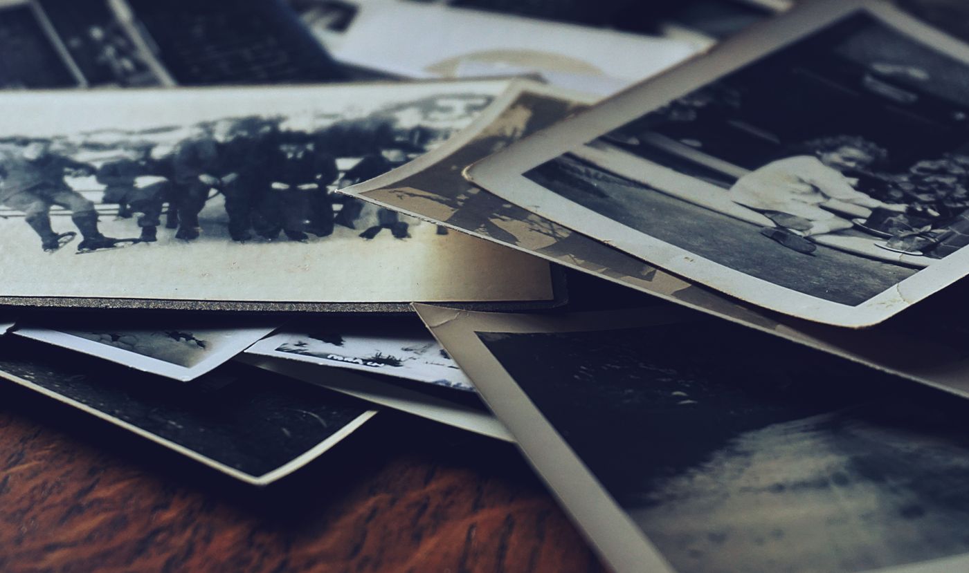 A stack of classic black and white photographs — photo by Suzy Hazelwood on Pexels