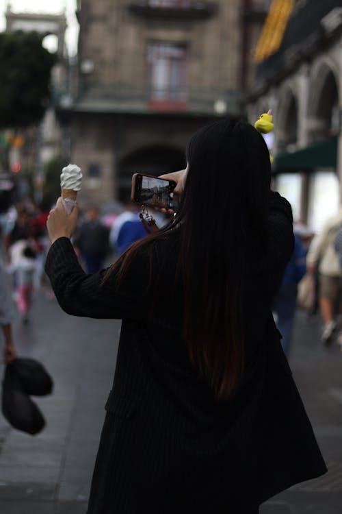 Back View of Woman Taking Pictures of Ice Cream