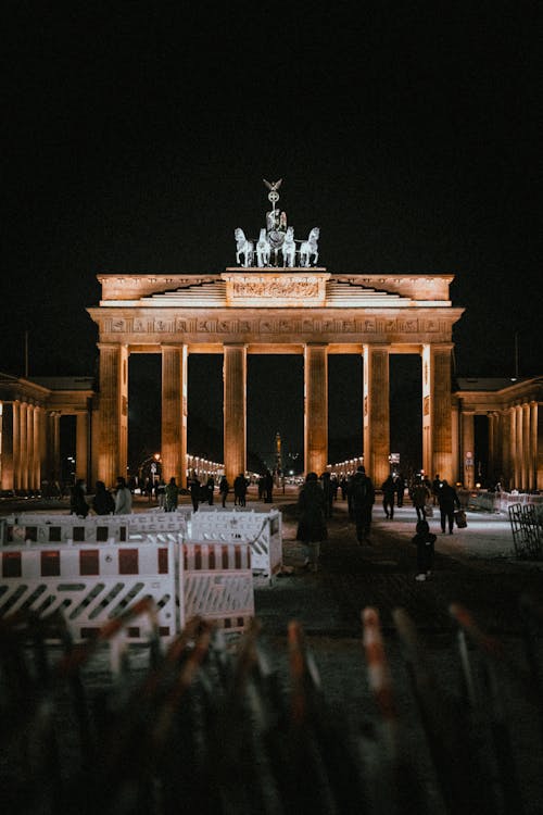 People Walking near Brandenburg Gate in a Winter Night, Berlin, Germany