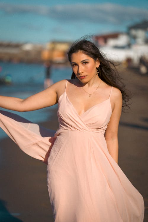 Portrait of Woman in Dress on Beach