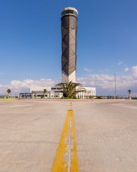 A stunning view of the control tower at Felipe Angeles Airport, Mexico, under a clear blue sky.