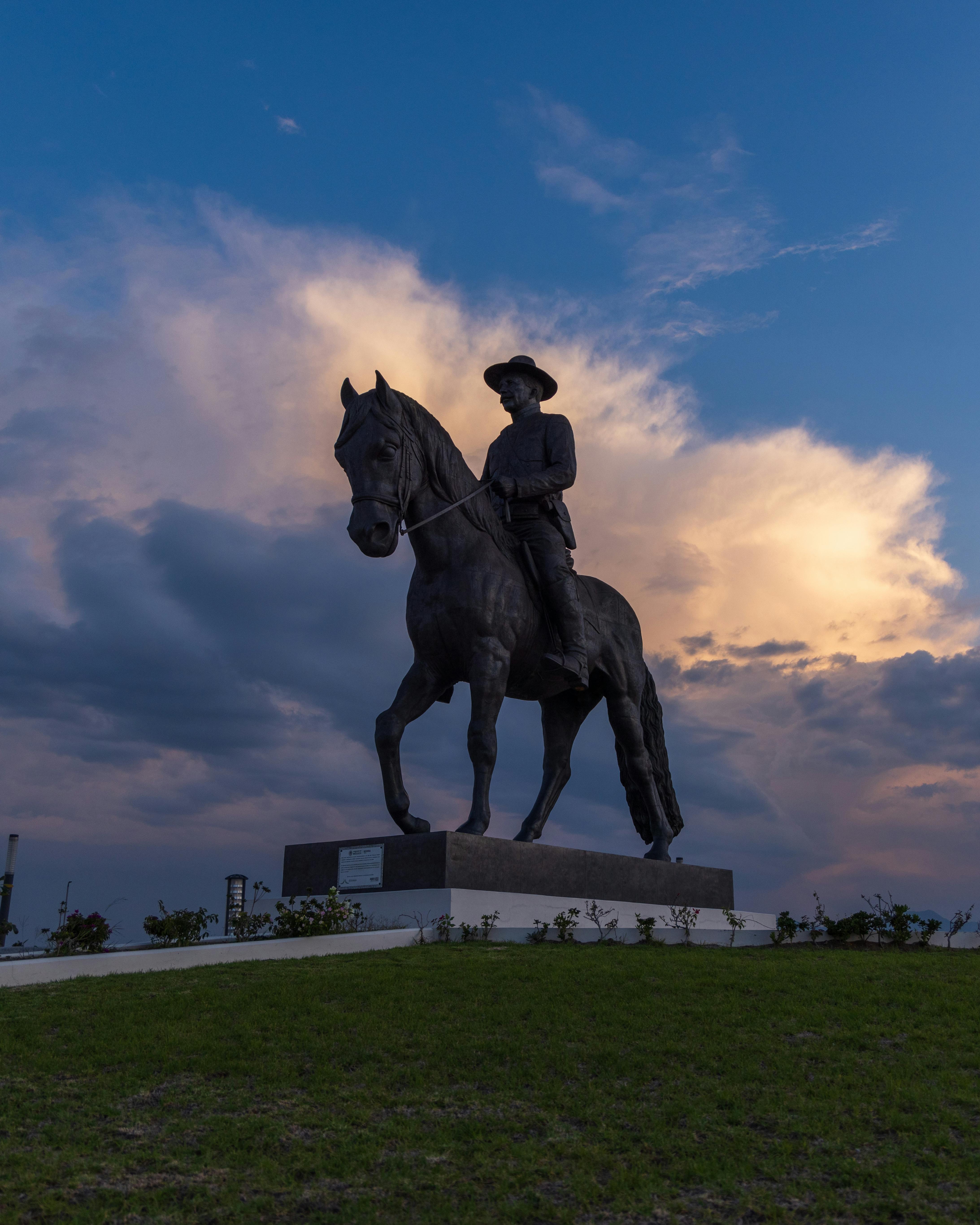 A scenic view of the equestrian statue at Felipe Ángeles International Airport during sunset in Zumpango, Mexico.