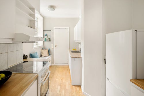 Empty Kitchen Interior with White Furniture