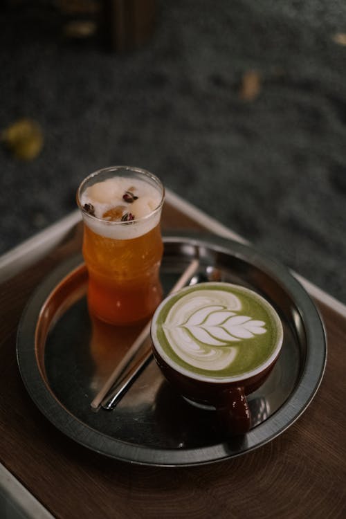 Beer with Syrup and a Matcha Latte on a Tray