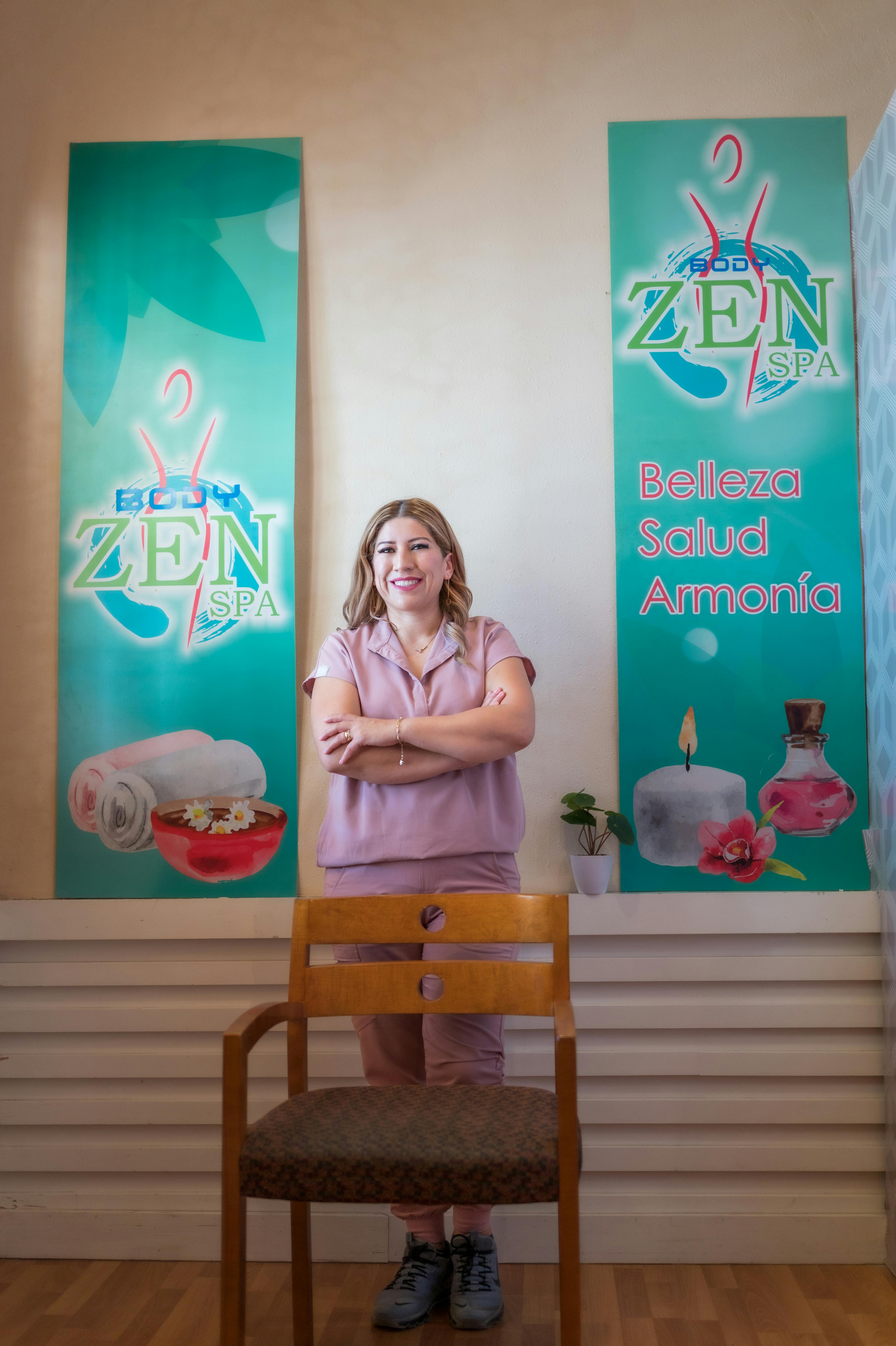 A smiling woman stands confidently in Zen Spa, Juárez, México.