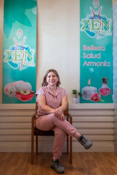 Portrait of a smiling woman sitting at a spa in Juárez, México, promoting wellness.