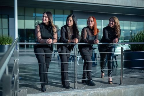Free Confident women in business attire standing outdoors, embracing teamwork and leadership. Stock Photo