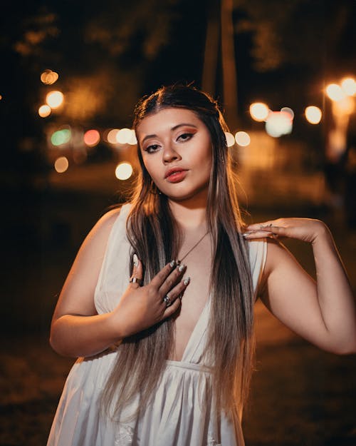 Woman in White Dress at Night