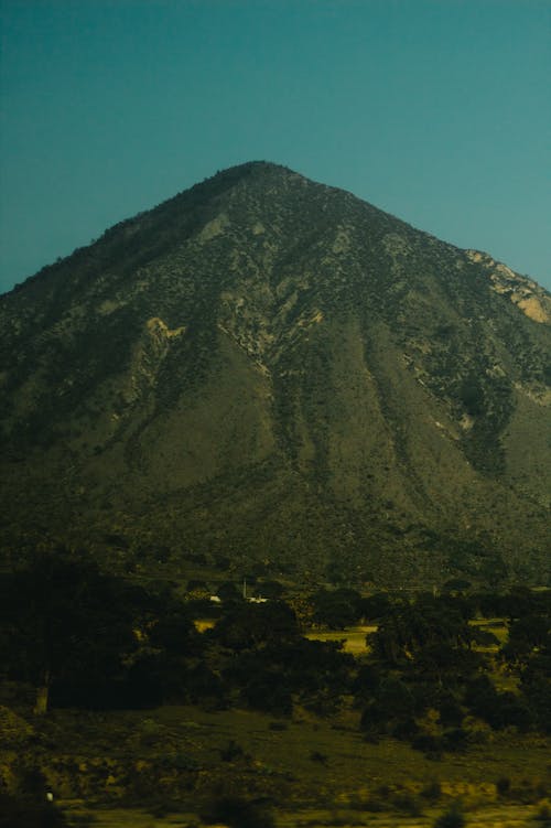 View of a Green Volcano under Blue Sky 