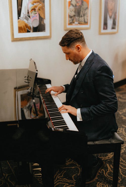 Man in a Suit Playing the Piano 