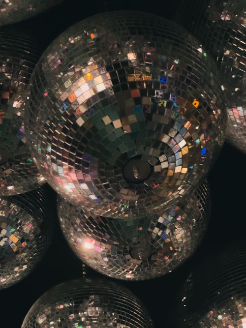 Free Multiple disco balls hanging in a vibrant nightclub setting in Amsterdam, capturing the nightlife energy. Stock Photo