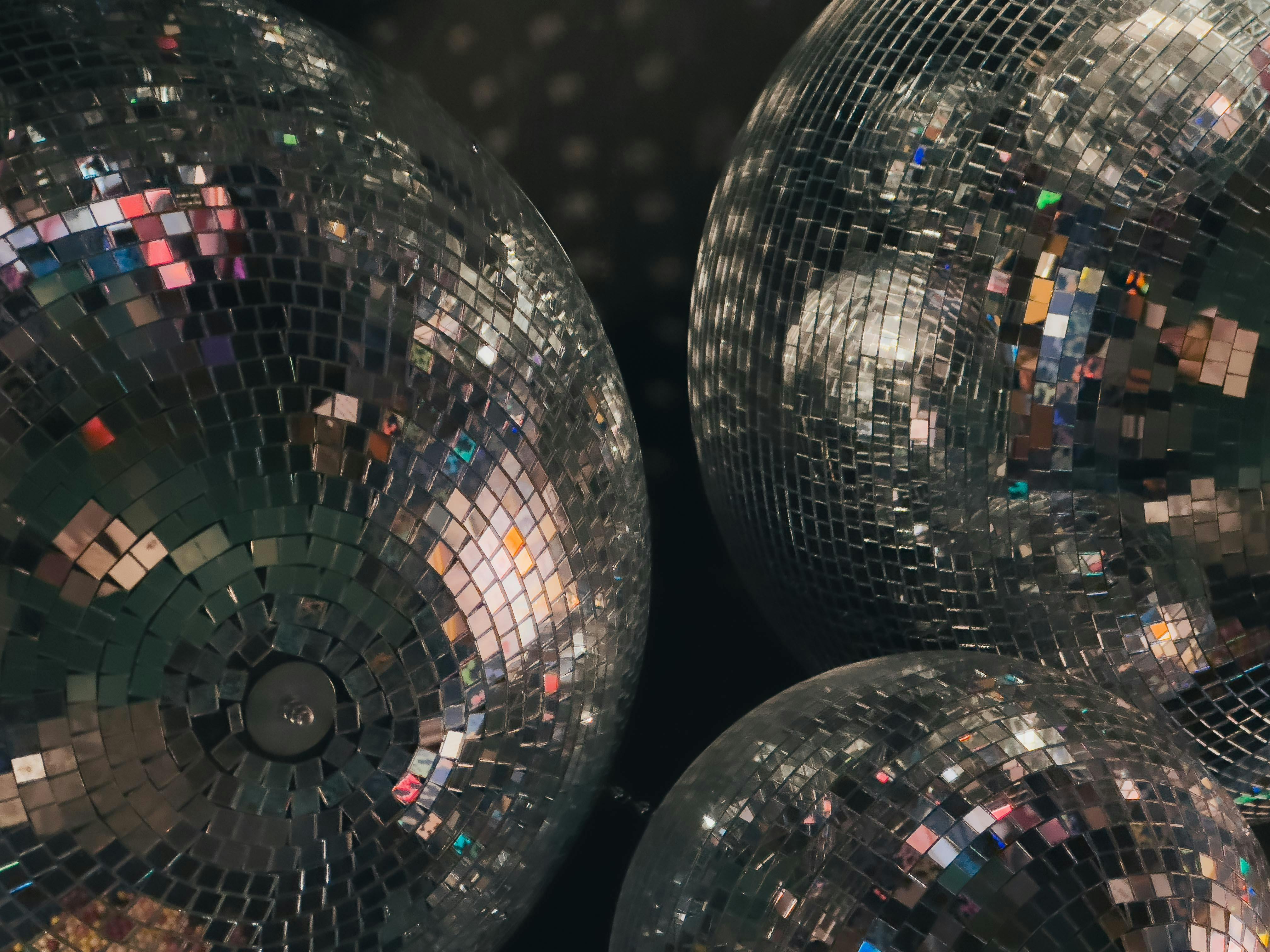 Disco balls in a dark room with a black background · Free Stock Photo