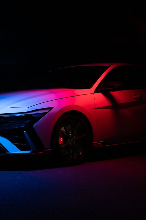 Free Stunning shot of Hyundai Elantra N with vibrant neon lighting in studio setting. Stock Photo