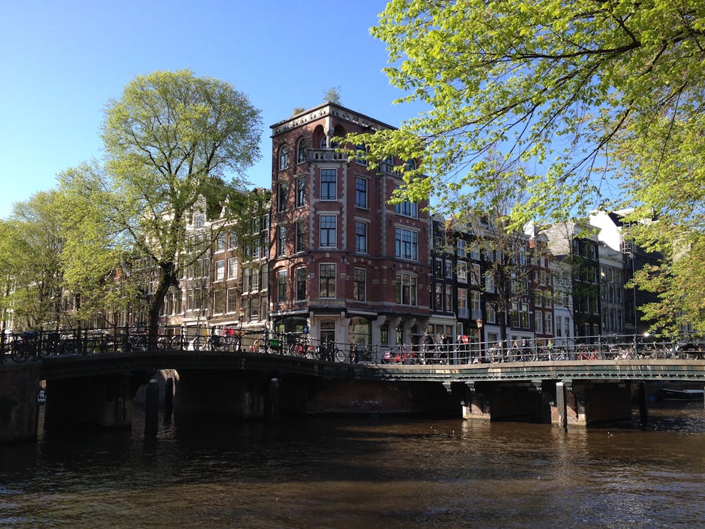 House and Bridge by Herengracht Canal in Amsterdam, Netherlands