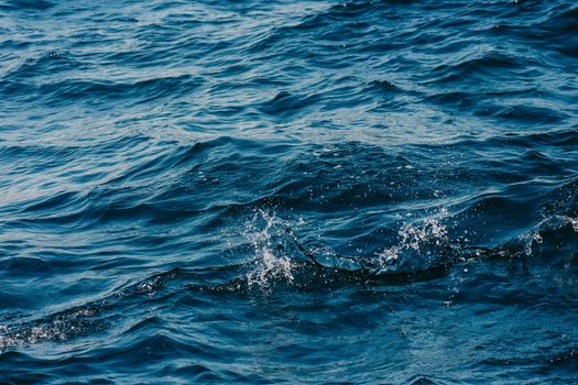 Dynamic ocean waves with splashes, showcasing nature's energy and texture.