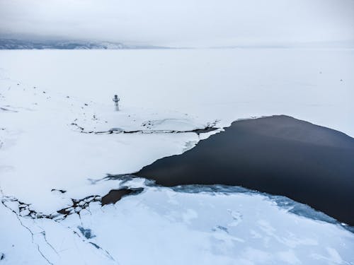 Dark Pond in Ice Desert