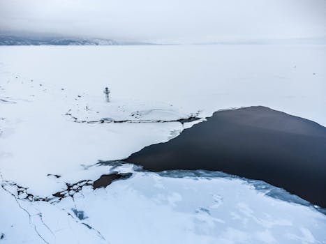 Stunning aerial view of a frozen lake and snowy landscape in Tolyatti, Russia.