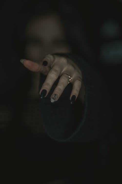 Woman Hand in Darkness