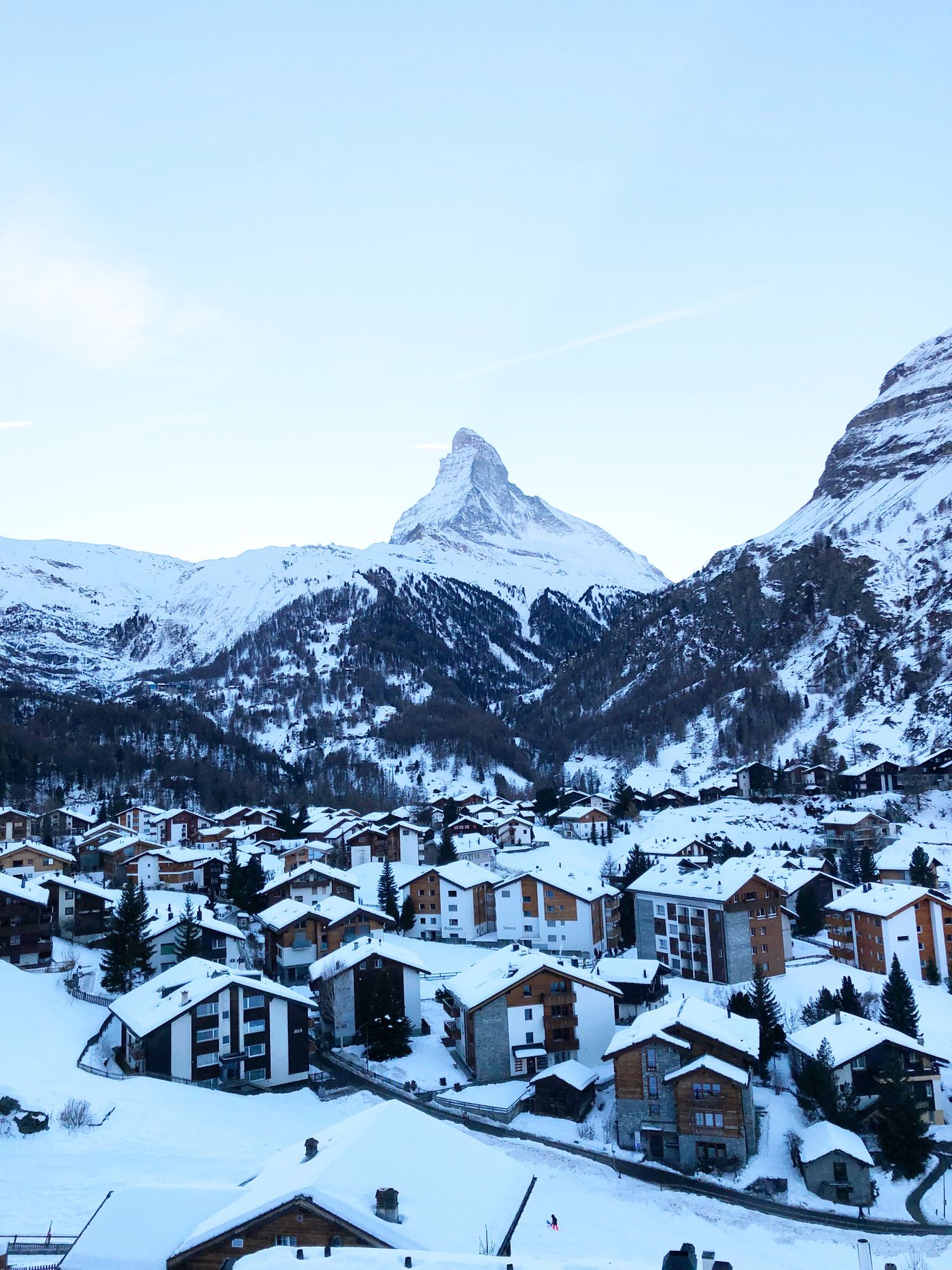 Aerial view of Zermatt village in winter with the Matterhorn behind