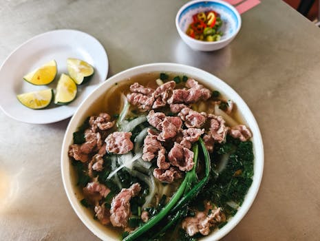 Tasty bowl of traditional Vietnamese pho with beef and herbs, perfect for a delightful meal.