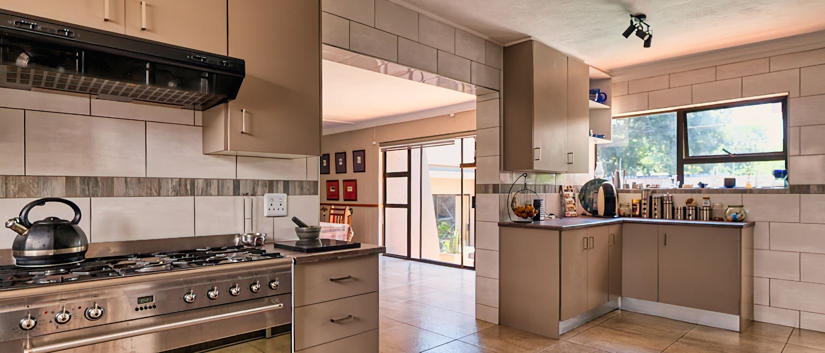 Kitchen Spraying in Seven Sisters — a decorator at work mid-project