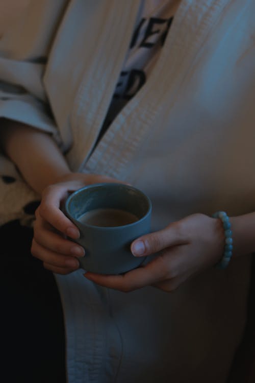 Woman Hands Holding Cup of Coffee