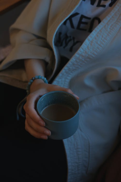 Woman Hand Holding Cup of Coffee