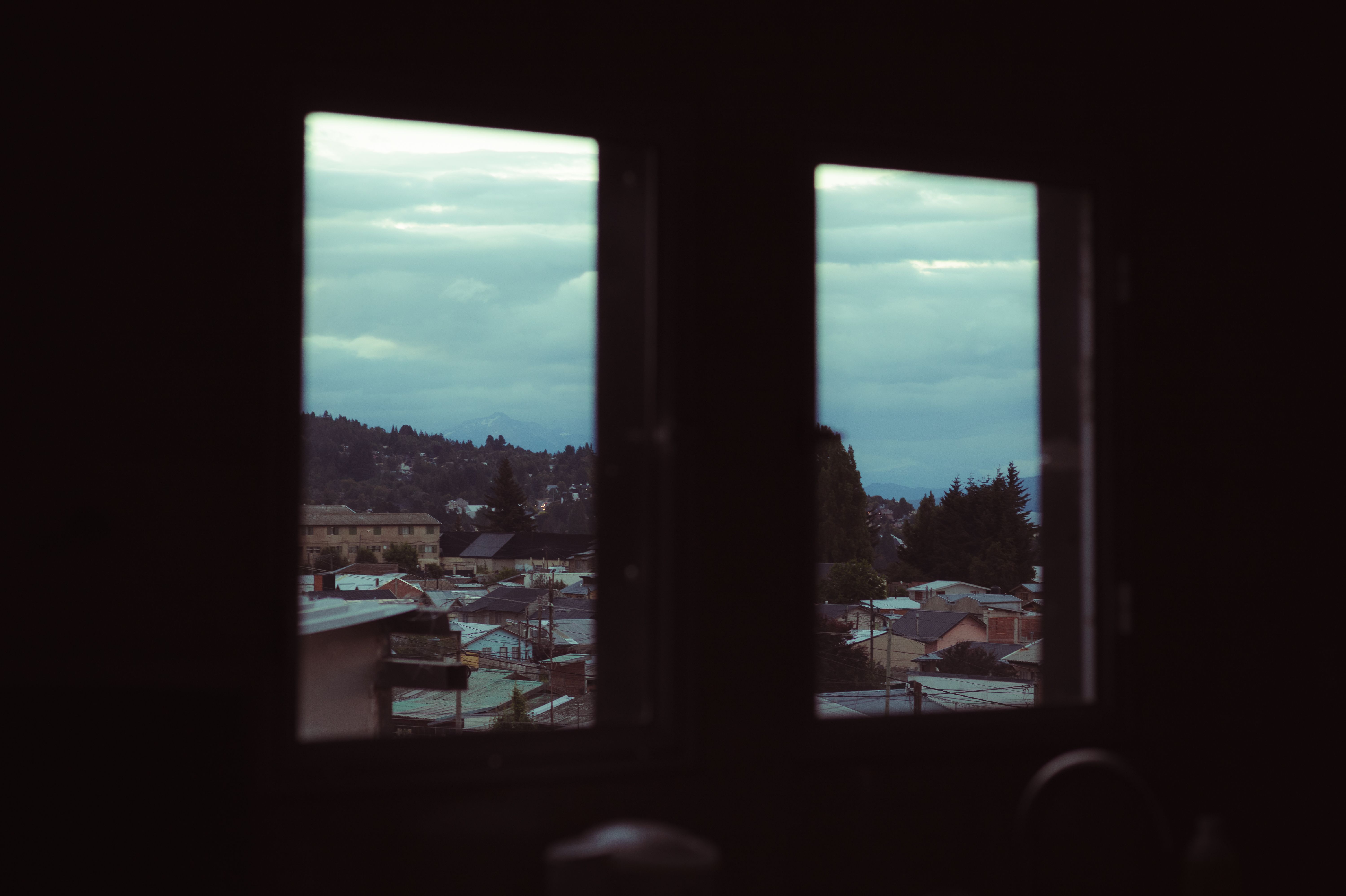 Rooftops Seen through Window · Free Stock Photo