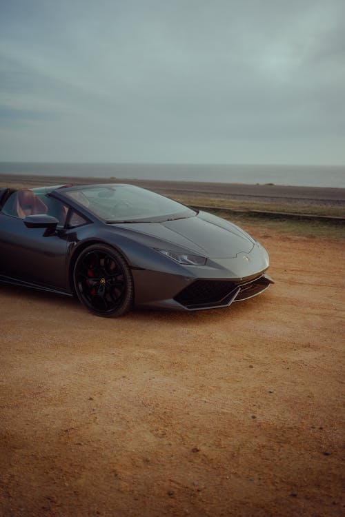 Gray Lamborghini Huracan on Seashore