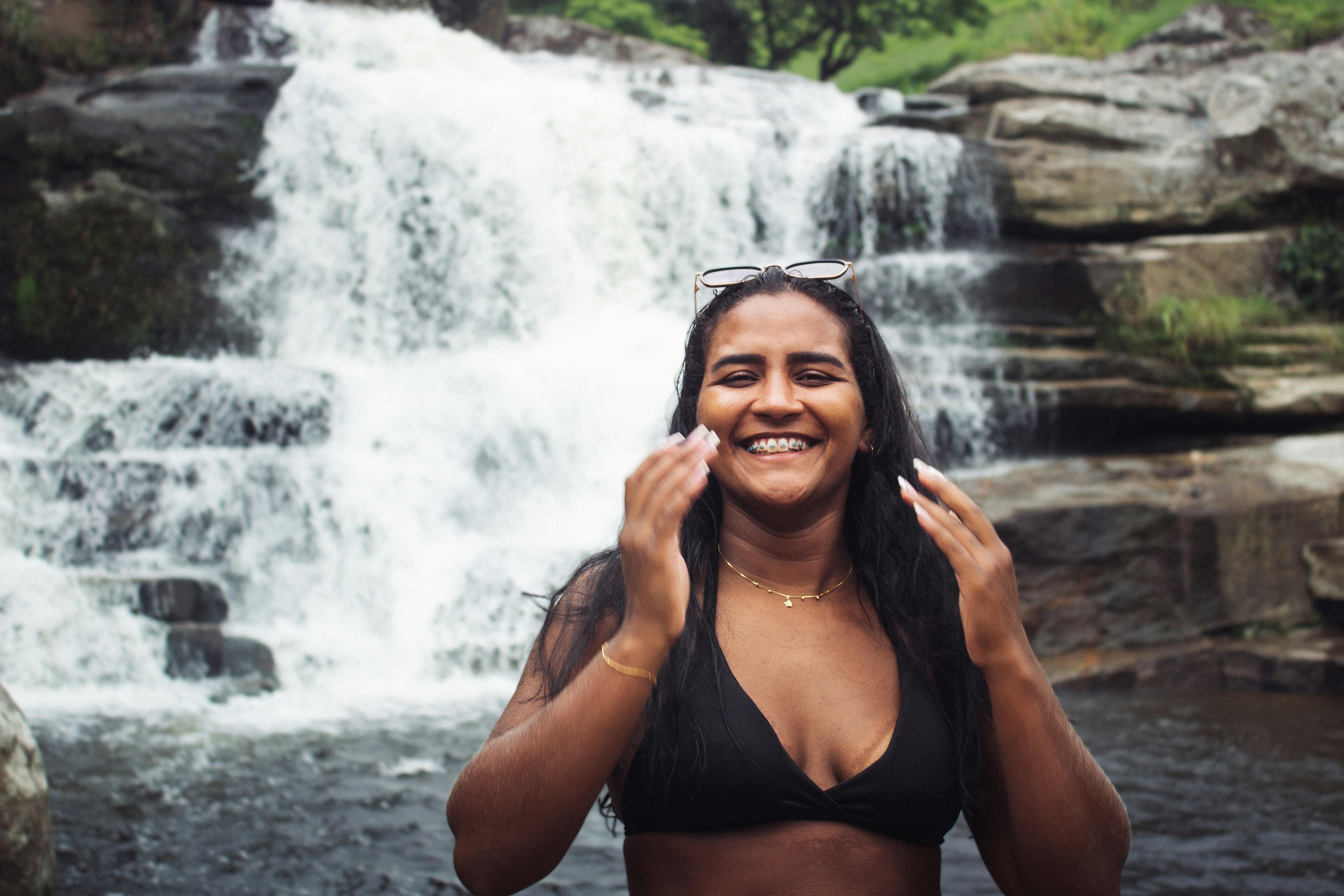 Portrait of Woman in Bra with Waterfall behind · Free Stock Photo