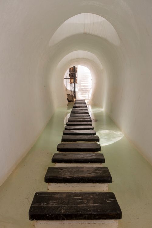 Free A tranquil corridor with stepping stones over water, perfect for travel inspiration. Stock Photo
