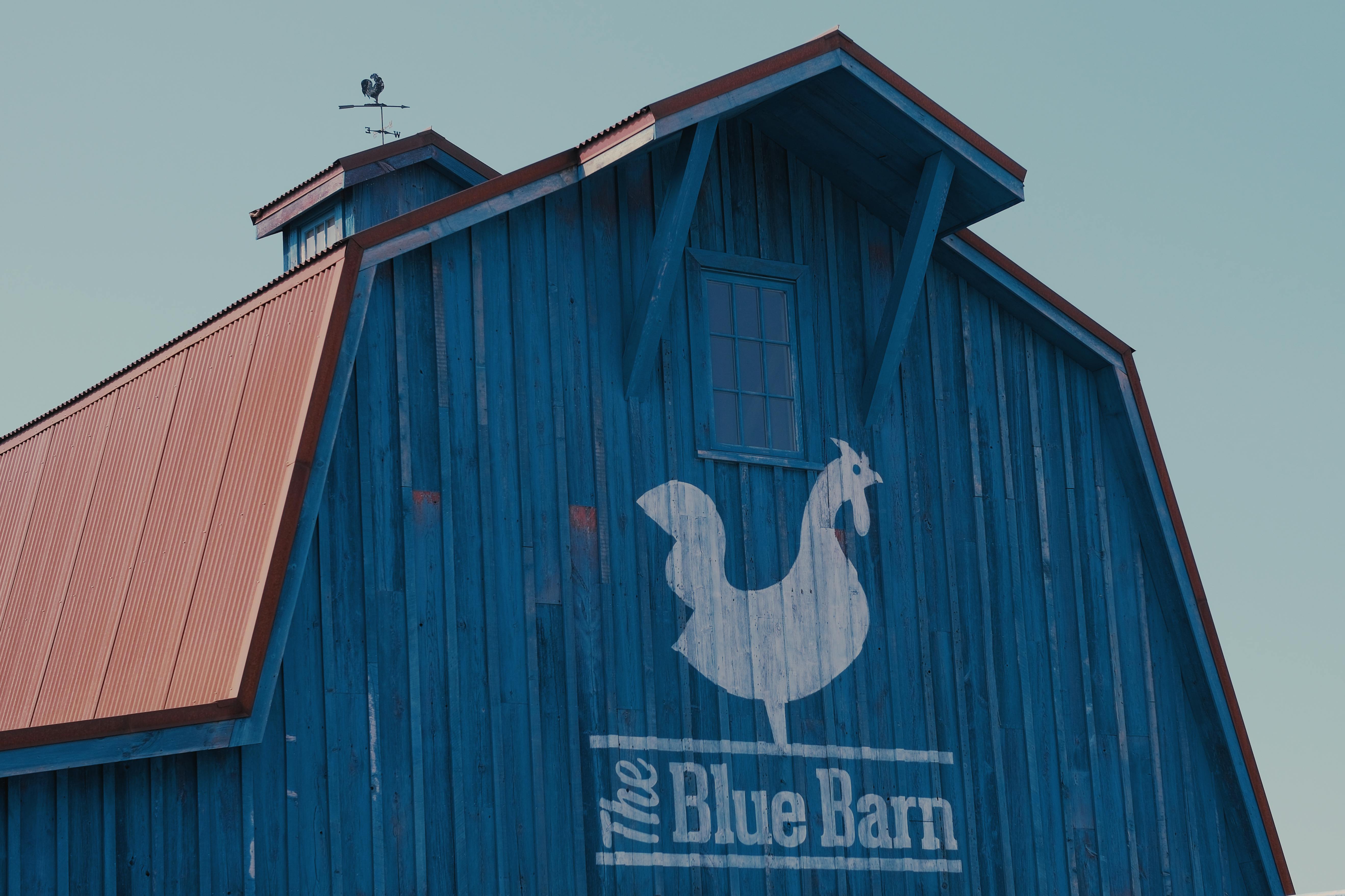 Logo on the Wooden Facade of The Blue Barn Restaurant