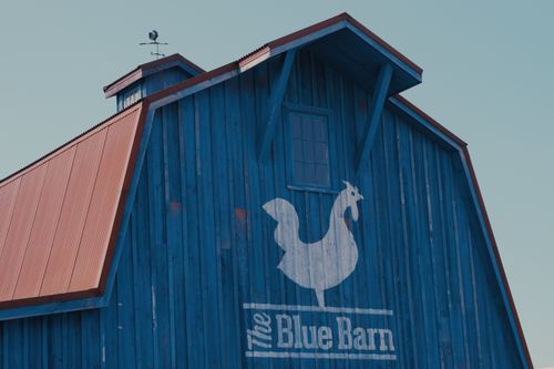Free Close-up of The Blue Barn's vibrant blue facade and logo in Falcon Heights, Minnesota. Stock Photo
