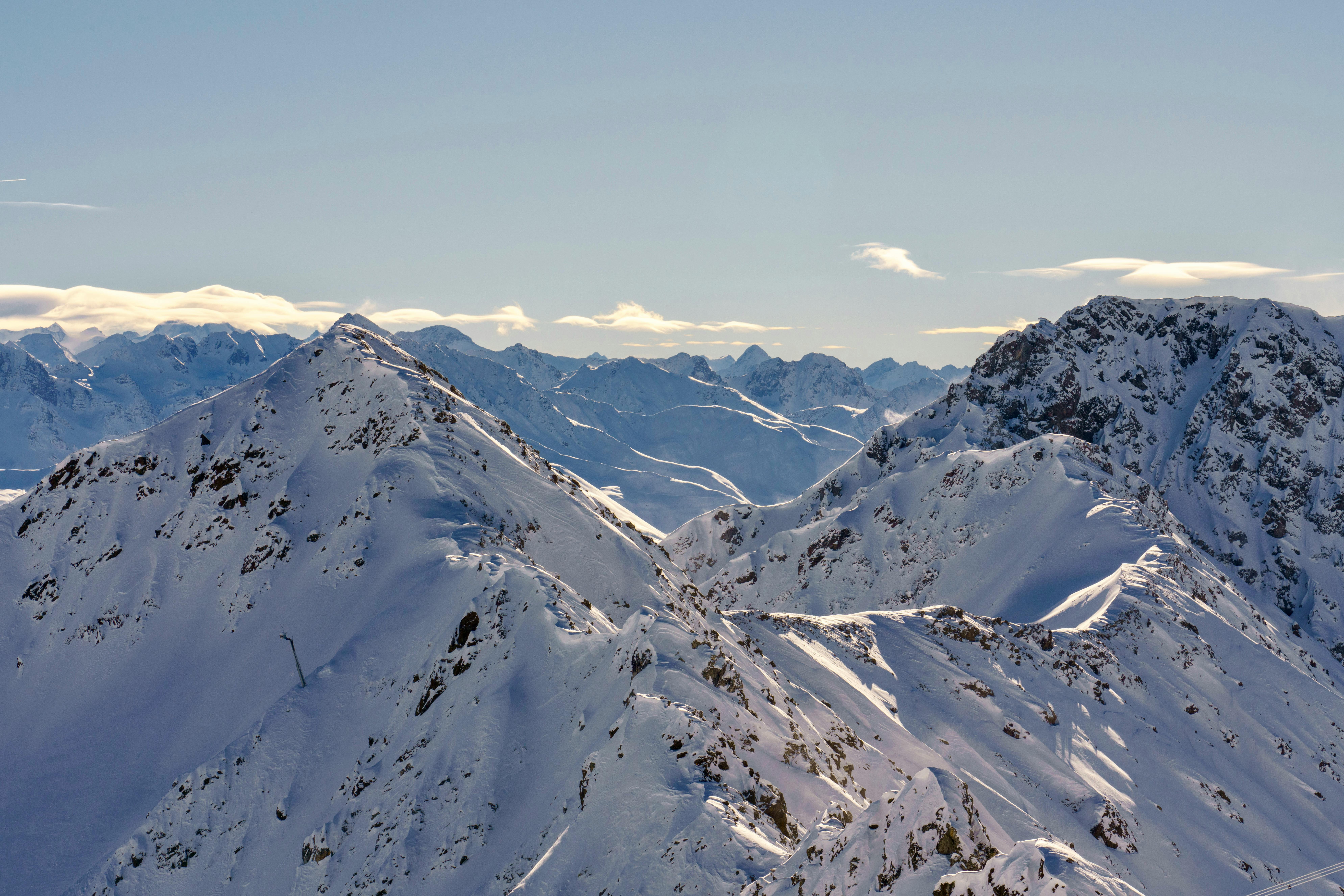 Beautiful snowy peaks of the Swiss Alps in Davos on a clear winter day.