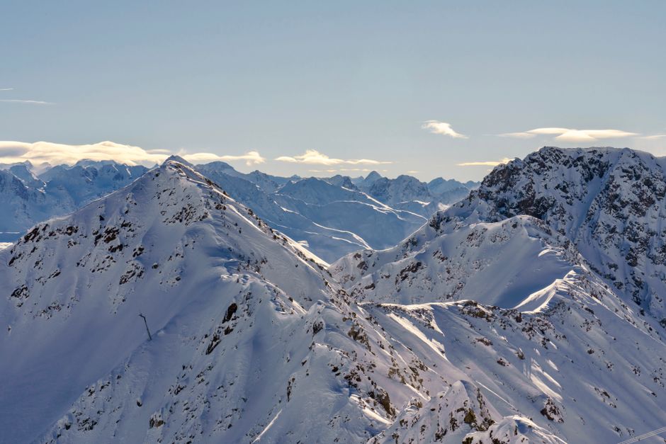 Beautiful snowy peaks of the Swiss Alps in Davos on a clear winter day.