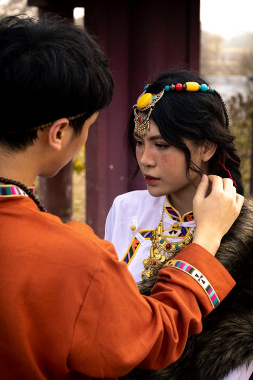 Photo of a Young Couple in Traditional Clothing 