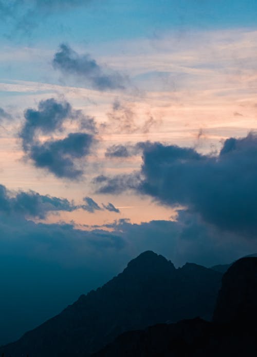 Moody clouds and beautiful mountains in black & bluish shade | lostintespace • Amaan