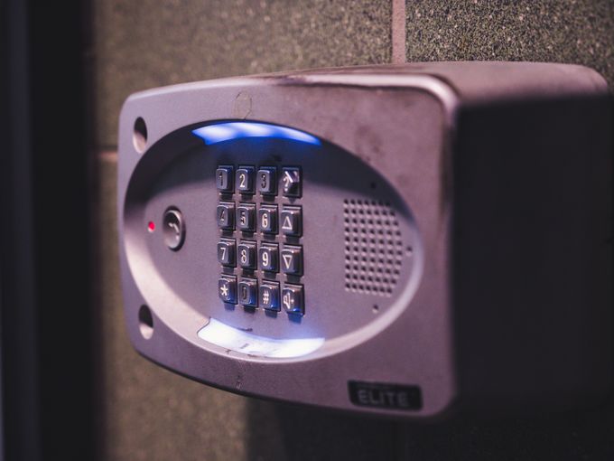 Illuminated security keypad mounted on a wall
