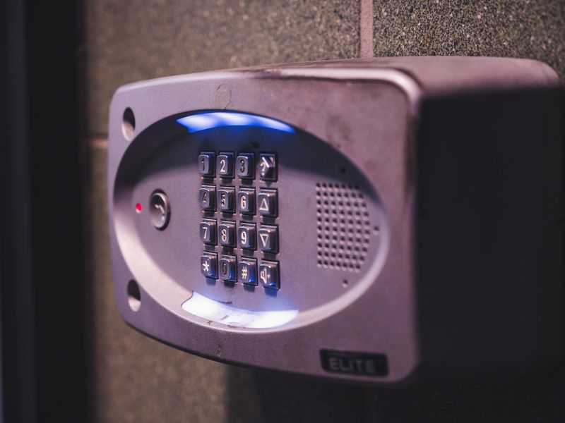 Illuminated security keypad mounted on a wall