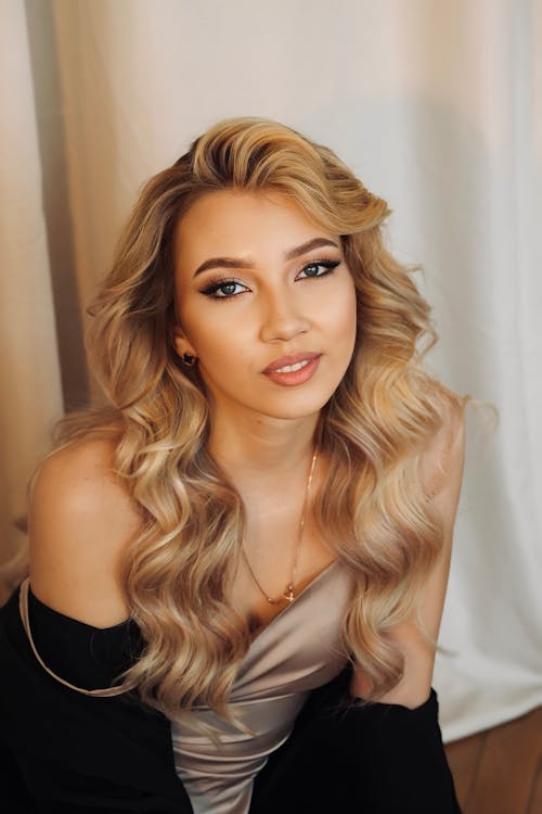 Beautiful Model in a Satin Beige Dress and a Black Blazer