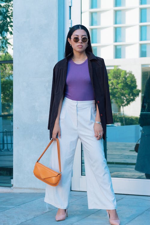 Woman in Sunglasses and with Bag