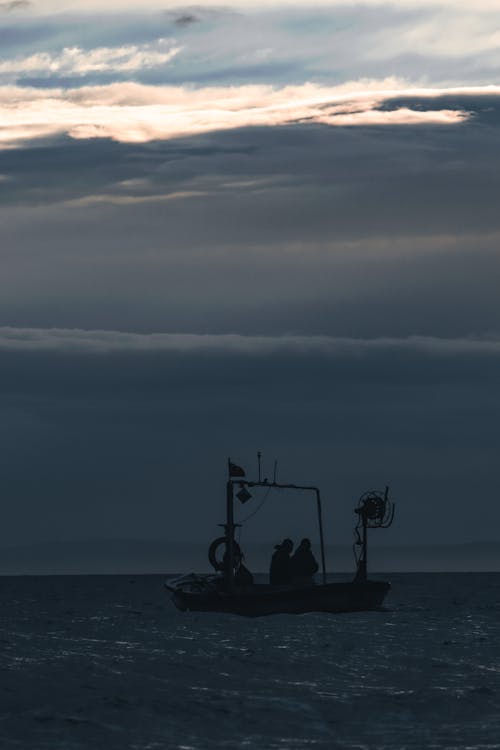 Fishermen Sitting on Fishing Boat