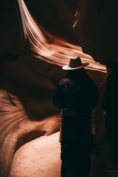 Woman Looking at Rock Formation, Antelope Canyon, Arizona, USA