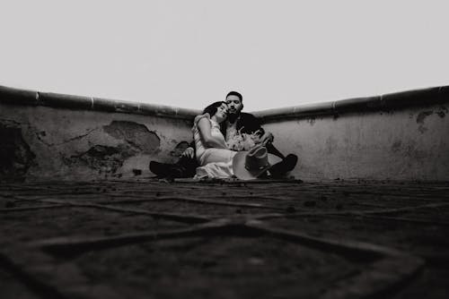 Couple Sitting Together on Roof