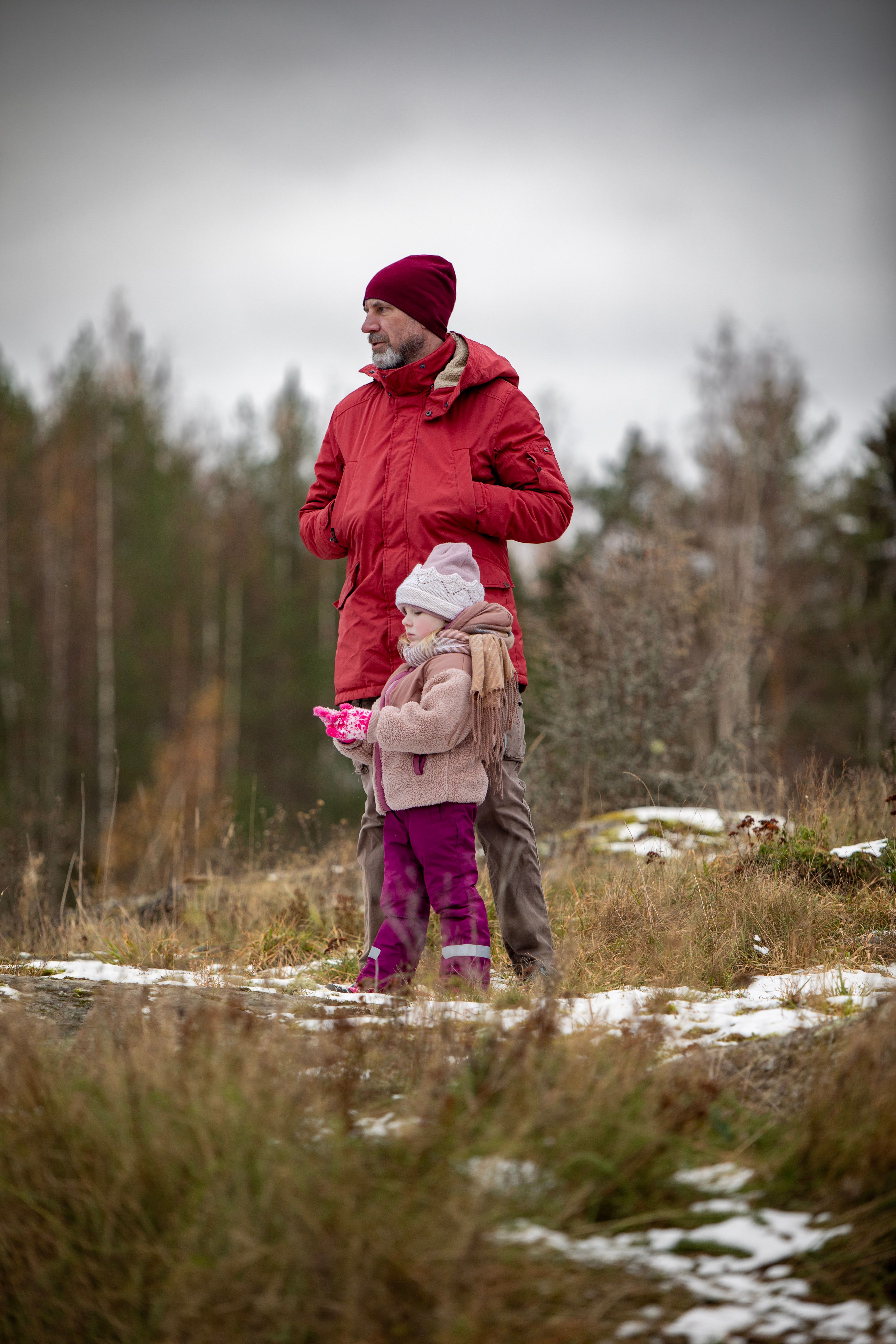 Father in Red Jacket Standing with Daughter in Winter · Free Stock Photo