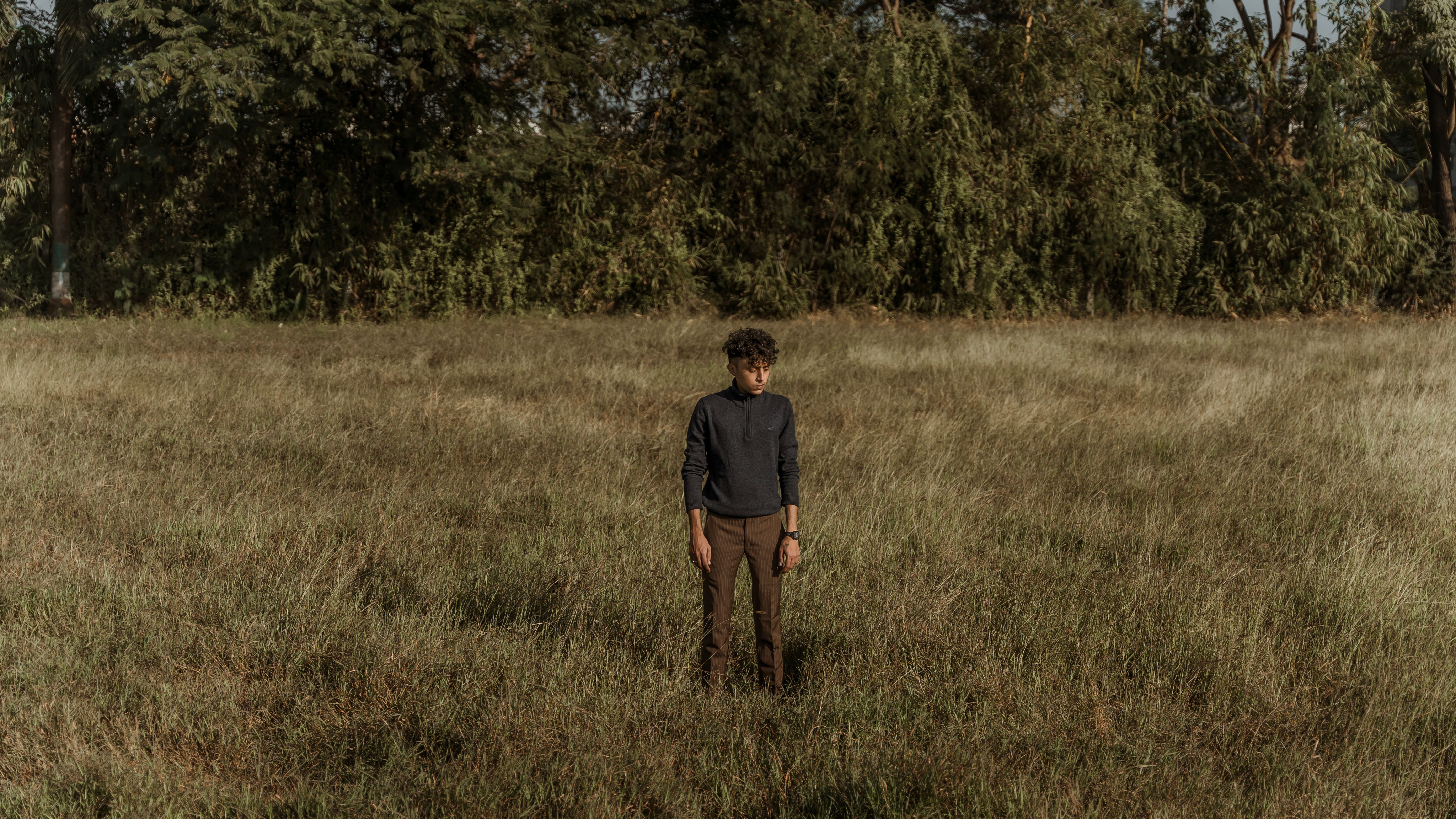 Man Standing on Grassland · Free Stock Photo