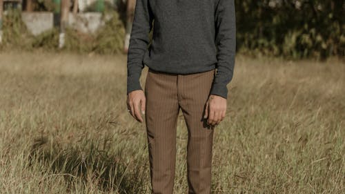 Man Standing on Grassland