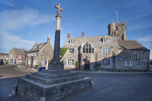 Stone Cross on Street in Corfe Town in England