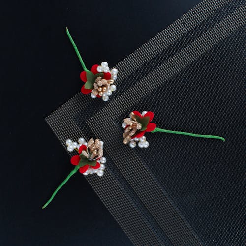 Top View of Simple Christmas Decorations Lying on Black Background 